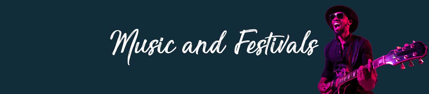 music-and-festivals-header-new an image of a man playing a guitar